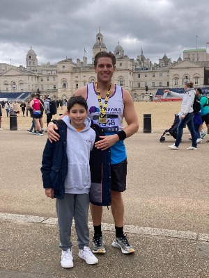 Harry stands outside Horse Guards Parade with his nephew having completed the London Half Marathon race.