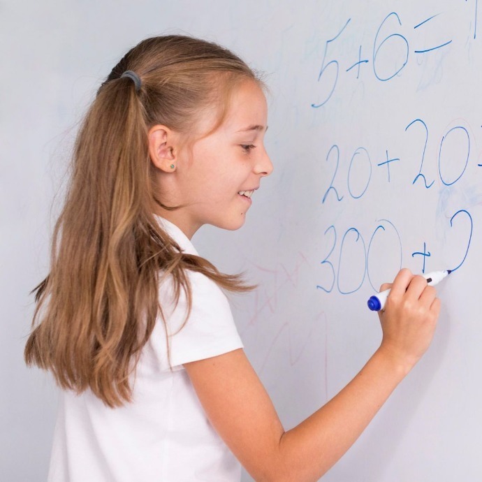 Children learning functional maths skills at school